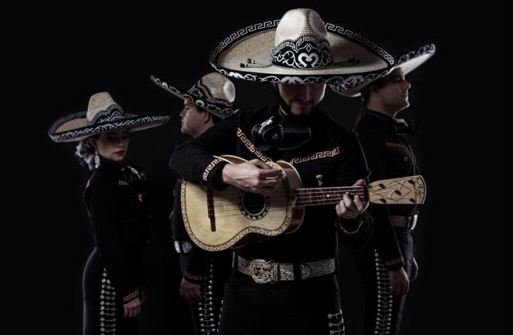 Mexican musicians play guitars