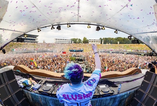 Slushii behind musical equipment